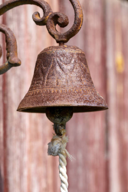 istock Old bell on a yacht with a rope close-up 1394399533