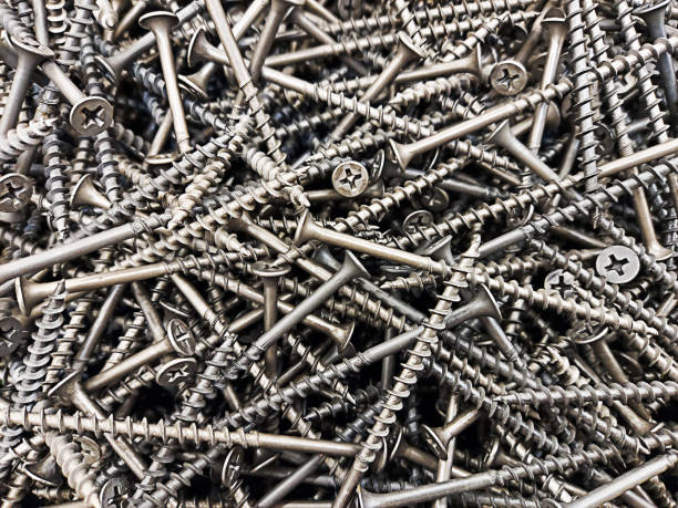 istock many self-tapping screws are scattered on the surface 1394400286