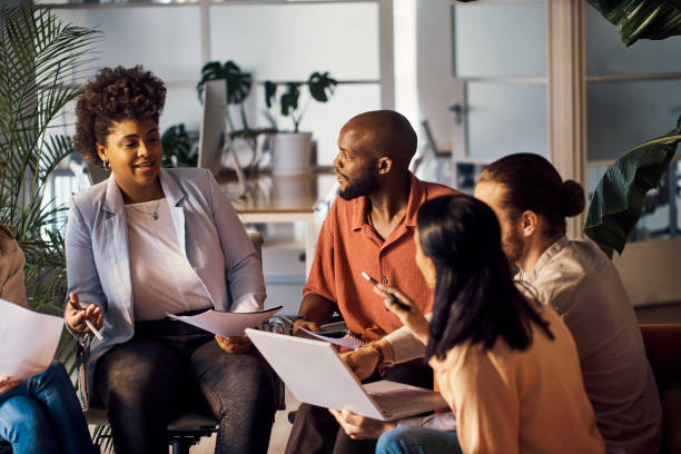 istock Diverse group of businesspeople having a meeting at work 1394400939