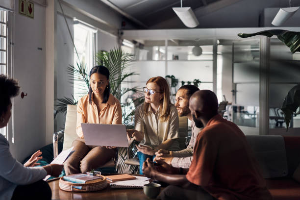 istock Five businesspeople having a meeting together in an office at work 1394400947