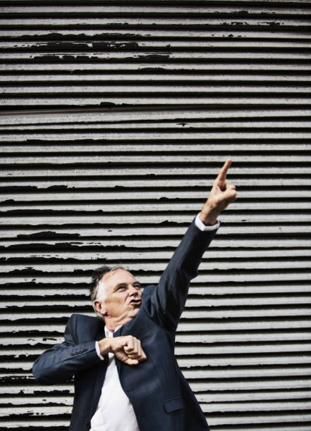 istock Middle age man beats his chest and points upwards 1394401662