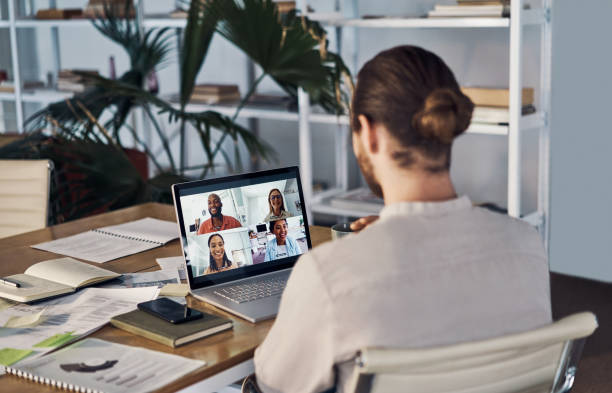 istock Group of businesspeople in a virtual meeting using a laptop 1394402059