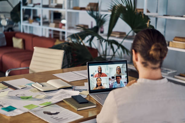 istock Group of businesspeople in a virtual meeting using a laptop at work 1394402061
