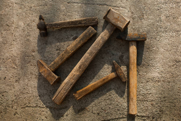 istock Set of hammers of different sizes on concrete pavement 1394402220