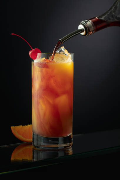 Tequila Sunrise alcoholic cocktail in a tall glass. stock photo
