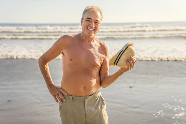 istock Senior men having great time on beach at the sunset 1394407648