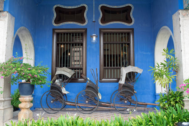 Old rickshaws at Cheong Fatt Tze Blue Mansion in Penang stock photo