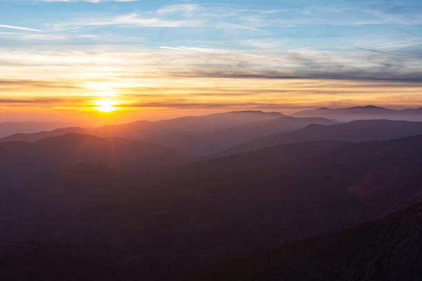 istock Fiery sunret over the foggy mountain. 1394409147