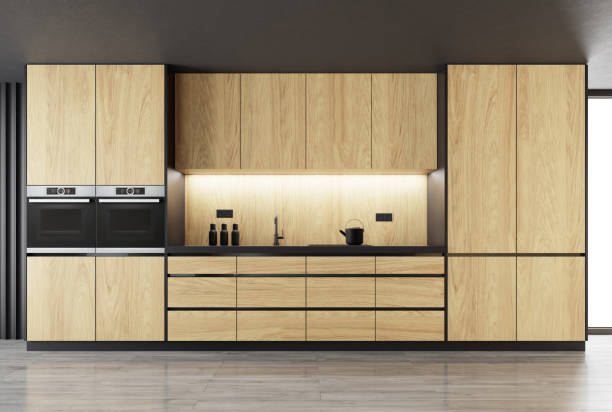 istock Matte black kitchen with natural oak wood on one wall 1394409168