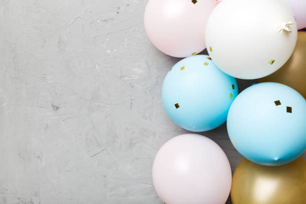 istock Background with fastive air balloons of round shape and confetti, multicoloured top view. Birthday party background 1394409934