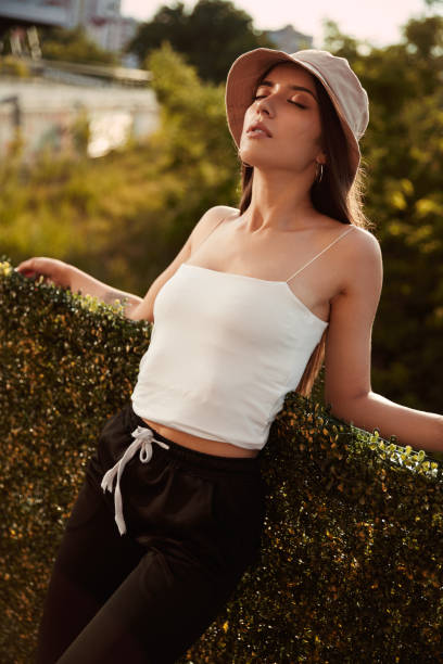 istock Young woman relaxing in summer park 1394410009