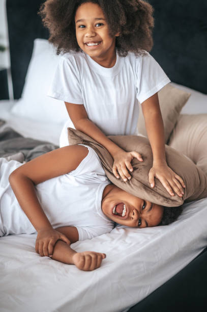 istock Two siblings playing together and looking excited 1394411278