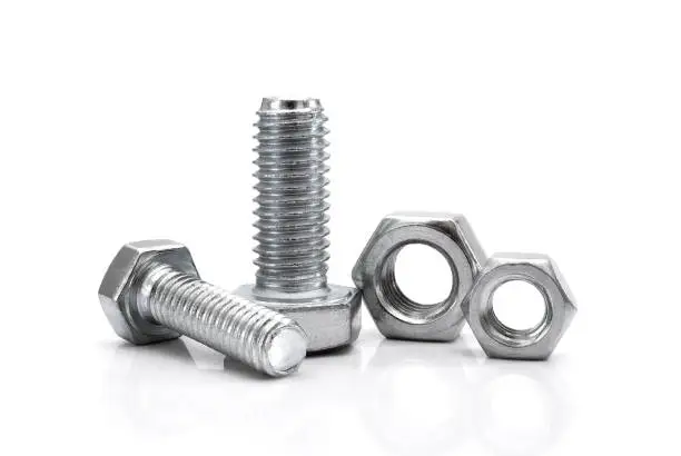 Various bolts and nuts on white background