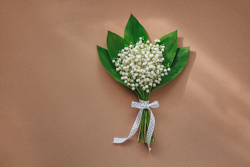 bouquet of lilies of the valley and space for text