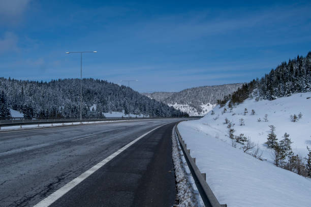 istock deep snow  asphalt highway road 1394413818