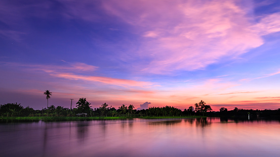 the sunset twilight landscape silhpuette blue sky and river colorfull white balance effec blur background