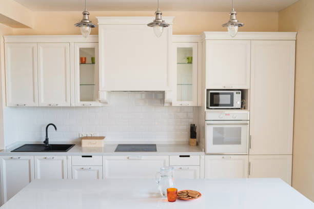 istock Modern interior design. Decanter with water and plate with waffles in the kitchen. 1394414923