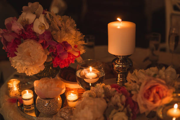 istock Floral compositions and candles on the decorated dining table. 1394416246