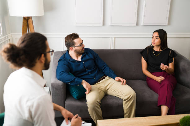 istock Angry couple fighting during therapy 1394417955