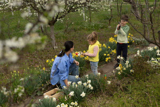 istock Mother with kids in garden 1394419146