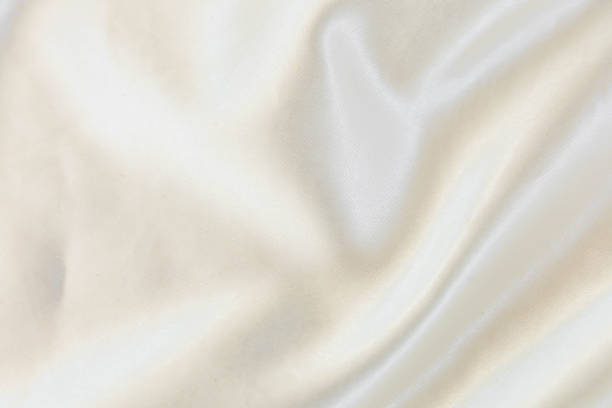 istock Smooth elegant white silk or satin texture can use as wedding background 1394421200