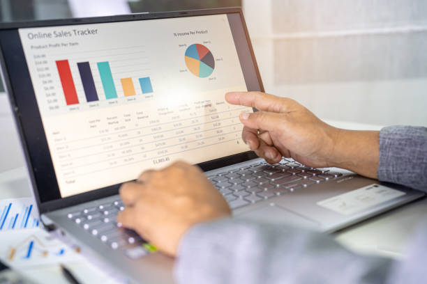 istock Asian accountant working and analyzing financial reports project accounting with chart graph in modern office, finance and business concept. 1394421301
