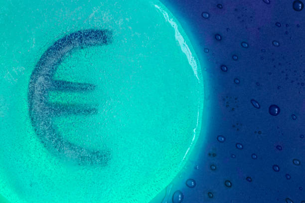 euro sign on two tone background with water drops. High quality photo