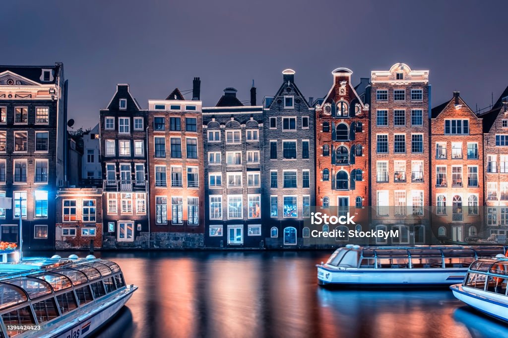 Architecture in Amsterdam Amsterdam city in the evening, Netherlands Amsterdam Stock Photo