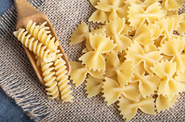 Photo of background, bowl, brown, cannelloni, capellini, closeup, cuisine, delicious, diet, fettuccine, food, fresh, fusilli bugatti cards, fusilli spirals, grain, healthy, ingredient, isolated, italian, italy