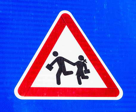 School crossing sign in a built up area