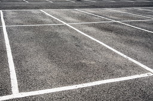 Tarmac painted with car parking spaces.