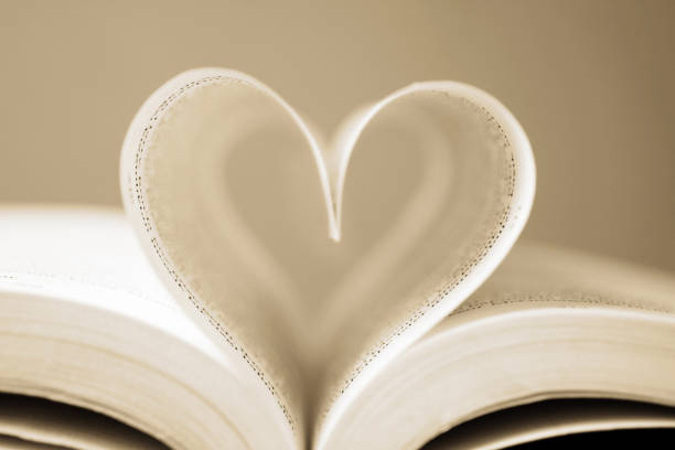 istock Love to reading books, pages folded into a heart shape 1394427245