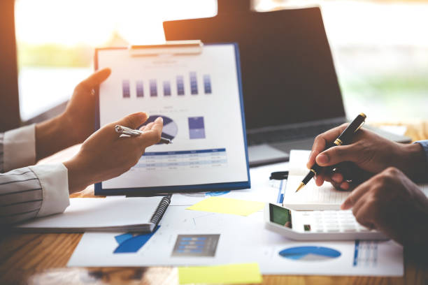 istock Team work with business analytic price chart on the table at the conference room. 1394433868