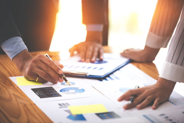 istock Team work with business analytic price chart on the table at the conference room. 1394434003