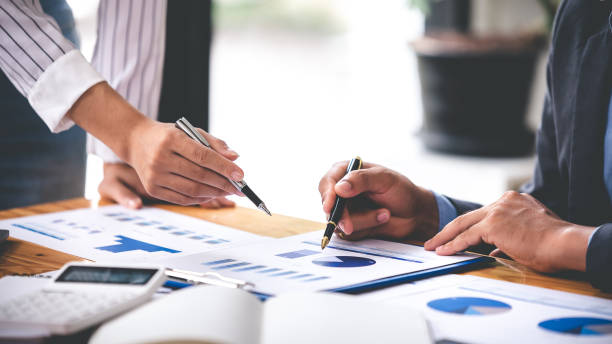 istock Team work with business analytic price chart on the table at the conference room. 1394434065