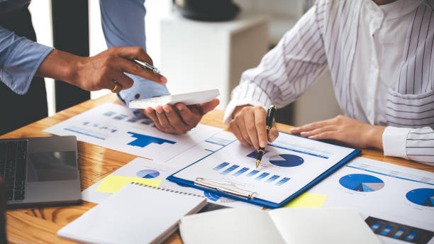 istock Team work with business analytic price chart on the table at the conference room. 1394434088
