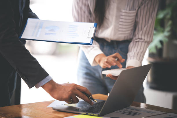 istock Team work with business analytic price chart on the table at the conference room. 1394434103