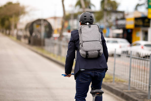 istock Man  on a bicycle going down the street 1394435871