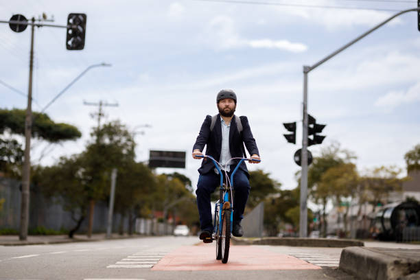 istock Man commuting to work by bike 1394435894