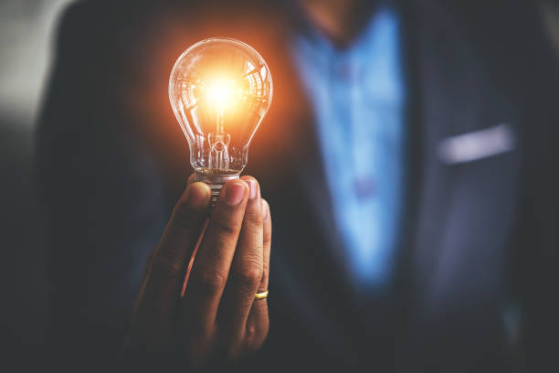 istock Hand holding a light bulb. Innovative concept with inspiration and energy saving concept. 1394437430