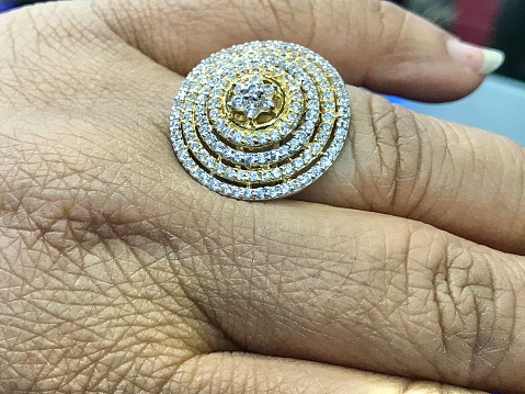 A lady wearing a new diamond-studded ring.