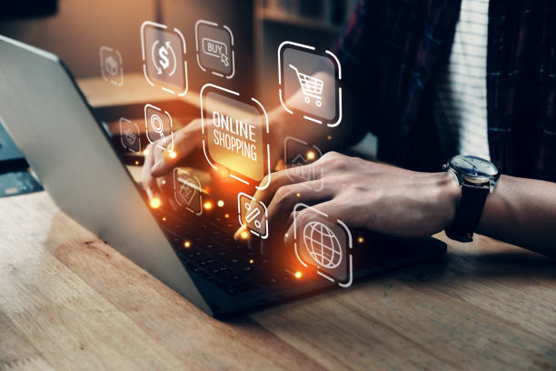 istock Business man using computer laptop with online shopping icons technology. 1394440530