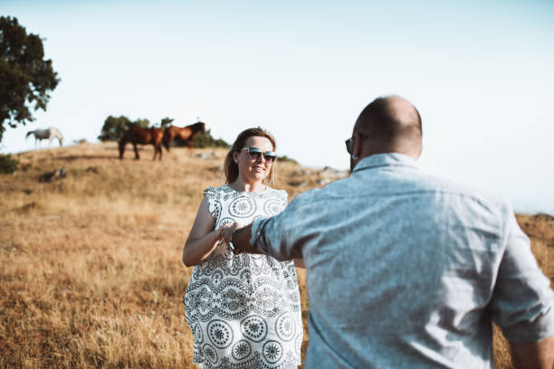 istock Freshly Married Couple Dancing While They Are In Picnic 1394440579