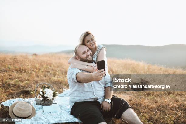 Freshly Married Couple Taking Selfie While They Enjoying In Picnic Trip Stock Photo - Download Image Now
