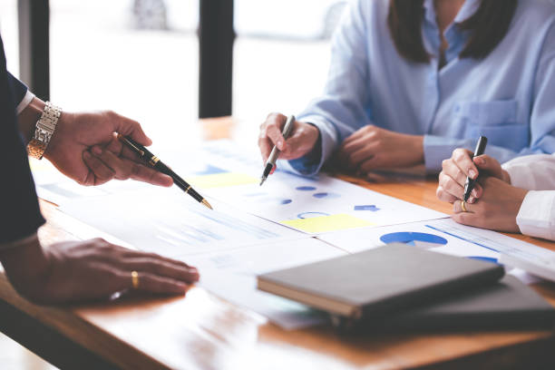 istock Team work with business analytic price chart on the table at the conference room. 1394446598
