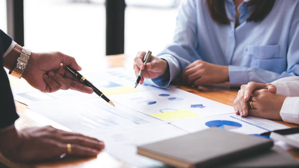 istock Team work with business analytic price chart on the table at the conference room. 1394446600