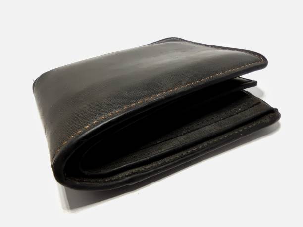 istock Black leather wallet. Black purse isolated on white background 1394454855
