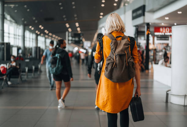 istock Solo Traveler Heading to a Flight Gate 1394456702