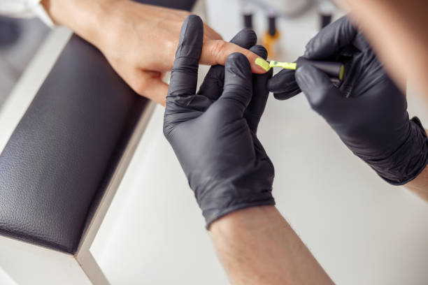 istock Proffesional manicure master working on nails in salon 1394459335