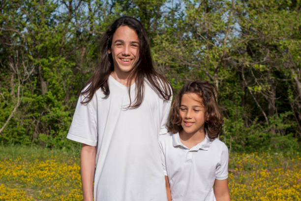 Having fun together, positive emotions, pastel colors. Healthy hair and clean skin. Copy space.